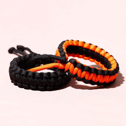 Xfoxstal 2Pcs Two-tone Paracord Bracelets Adjustable Handmade Braided Survival Bracelets for Women Camping Traveling Climbing Outdoor (Black and Orange)