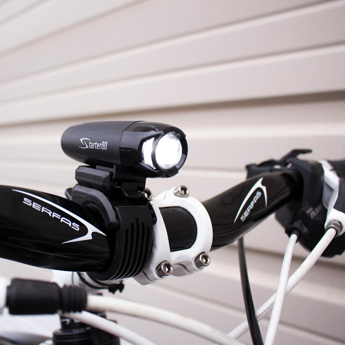 Serfas Starter Headlight, for Bicycles, E-Bikes, Mountain Bikes, and Road Bike, 80 Lumens, AA Battery, and Universal Handle Bar Mount Included