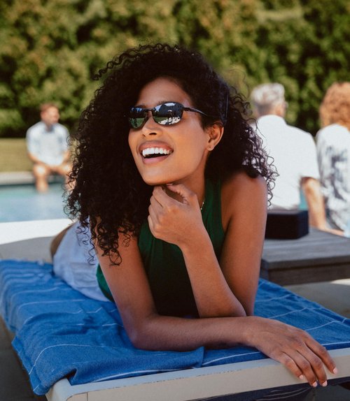 Revo Descend Pro Petite Polarized Sunglasses | Lightweight Wraparound Profile | Sporty Comfortable Frameless Design | Crystal Purple Frame/Evergreen Lens