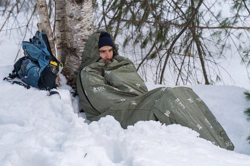 SOL Escape Bivvy with Hood - Emergency Preparedness Blanket - Reflects Up to 70% Body Heat - Outdoor Survival Bivvy - Water Resistant - Durable & Breathable - Winter Camping Supplies - Green